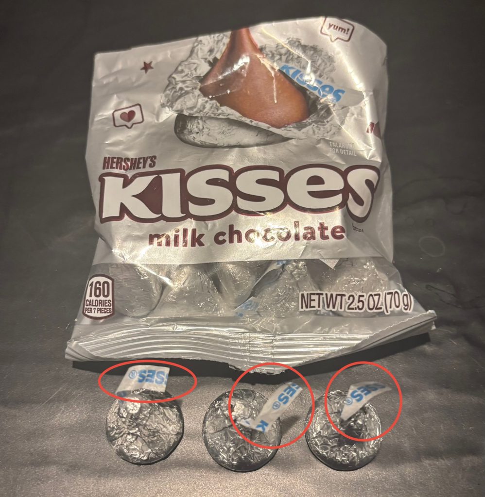 A Hershey's Kisses bag and 3 kisses with their plumes highlighted.